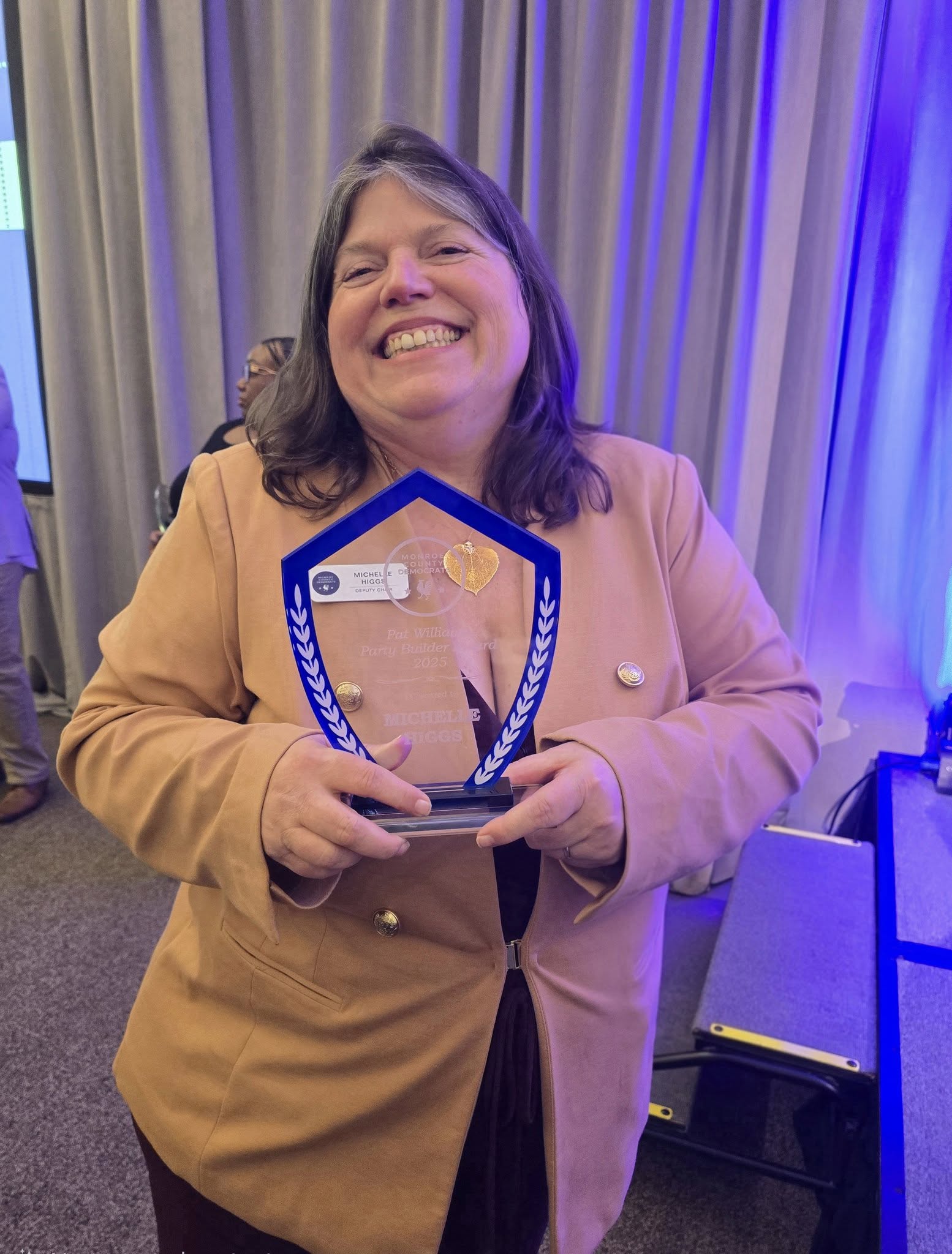 Michelle wins the Pat Williams Party Builder of the Year Award, at the Monroe County Democratic Party of Indiana's Vi Taliaferro Dinner, for the work she is doing with the Indiana Rural Summit.