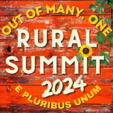 Logo image with red barn siding and ivy and sunflowers, with the words Out of Many, One Rural Summit 2024 E Pluribus Unum